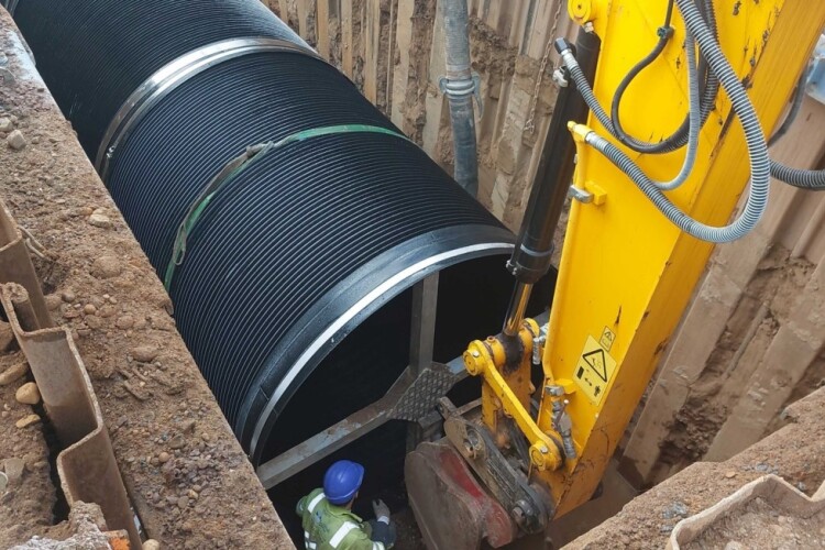 Steel reinforced composite sewers being laid in Perth