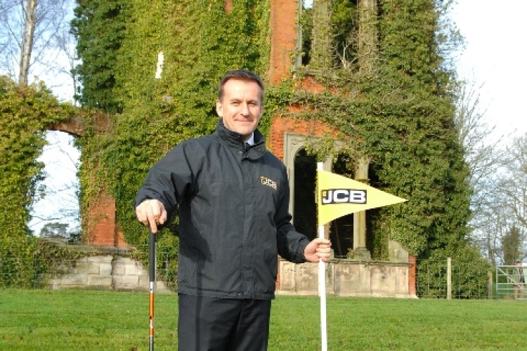 JCB CEO Graeme Macdonald in front of the ruins of Woodseat Hall where the new JCB golf course will be built