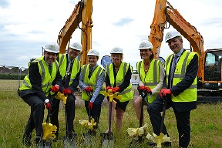 Local dignitaries pose for a ground-breaking photo call. Willmott Dixon operations director Richard Jones is on the right.