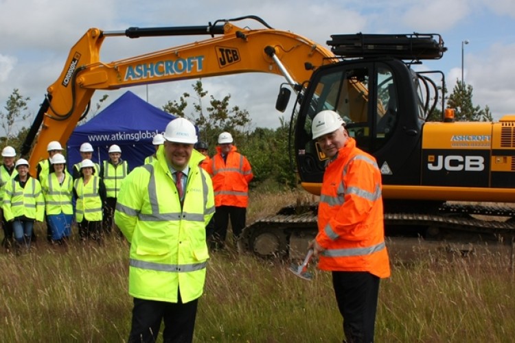Dave Polkey, head of Atkins&rsquo; Whitehaven office, and Robertson regional director Martin Westgate break ground at the site of Atkins&rsquo; new Whitehaven office