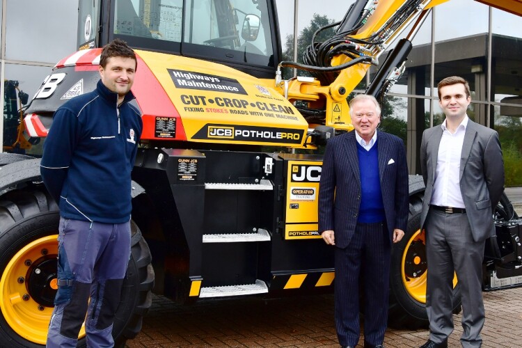JCB chairman Lord Bamford (centre) handed over the keys to machine to (left) James Harper, Stoke-on-Trent City Council&rsquo;s highways team manager, and chair of highways Daniel Jellyman