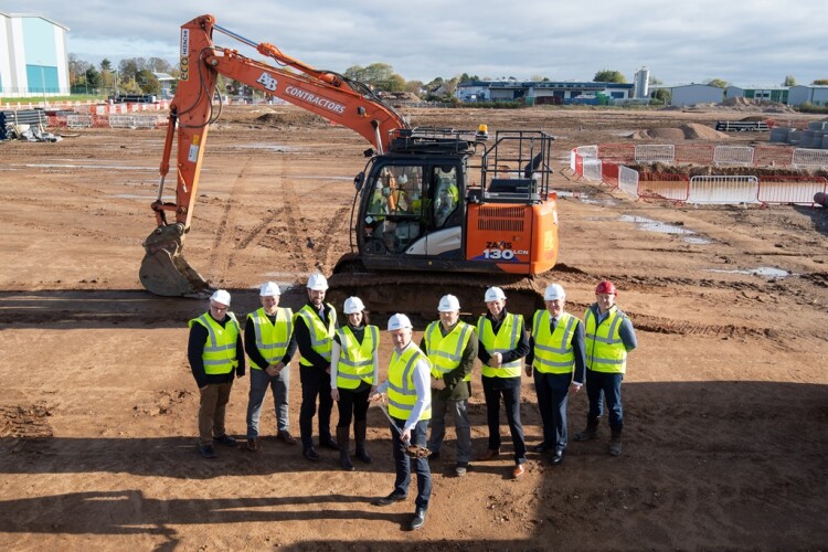 Project team members pose for official ground breaking