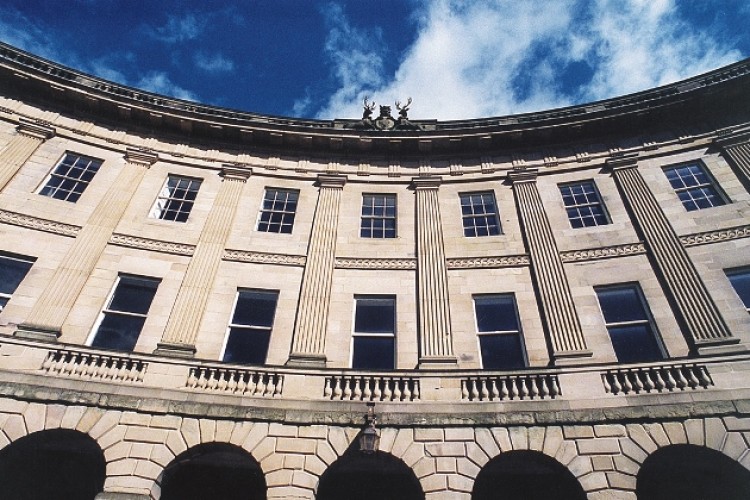 Buxton's historic Crescent and the Pump Room (below)