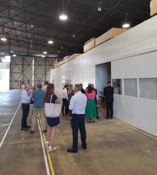 Visitors tour the factory on opening day