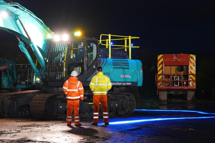 The Kobelco SK350 is rigged with cameras and alarms